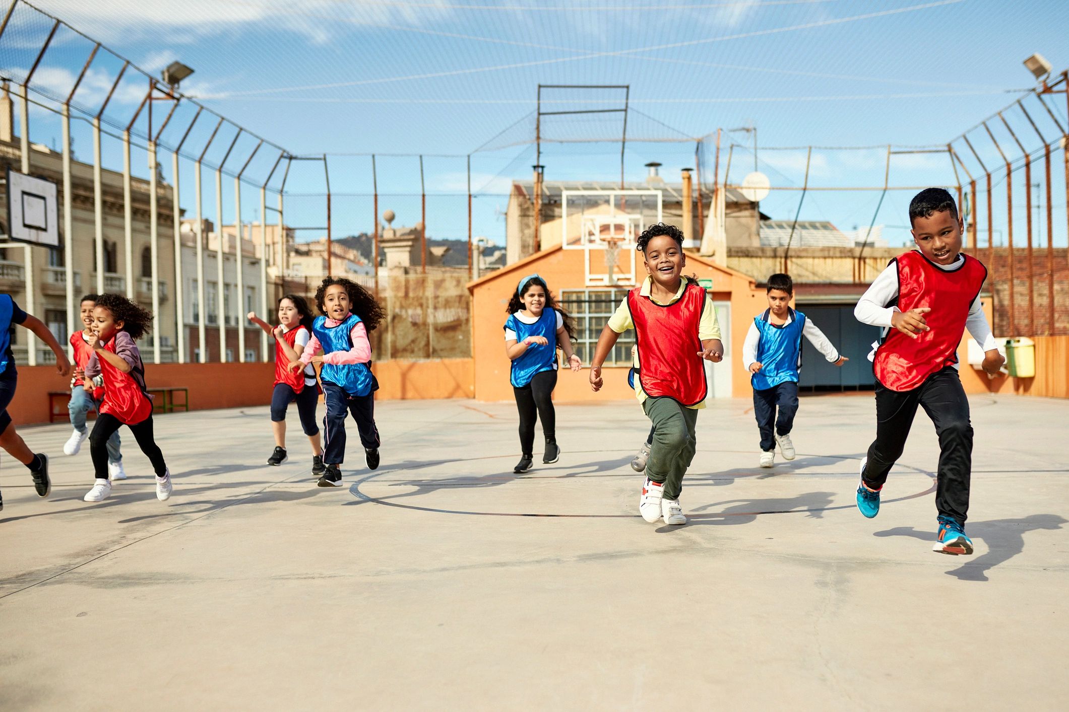 Children running together during an outdoor sports activity