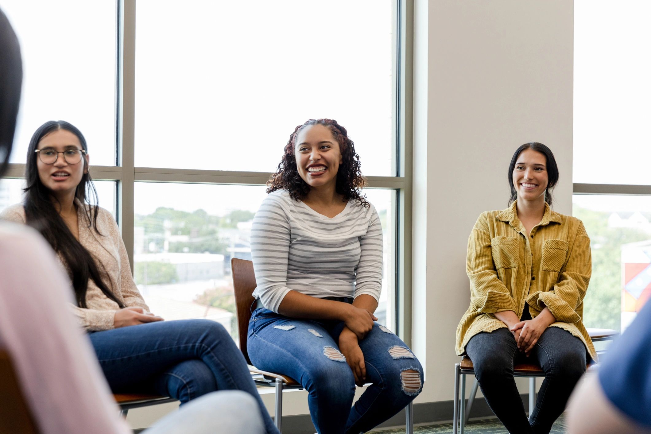 Youth group gathered in a circle for discussion and mentorship
