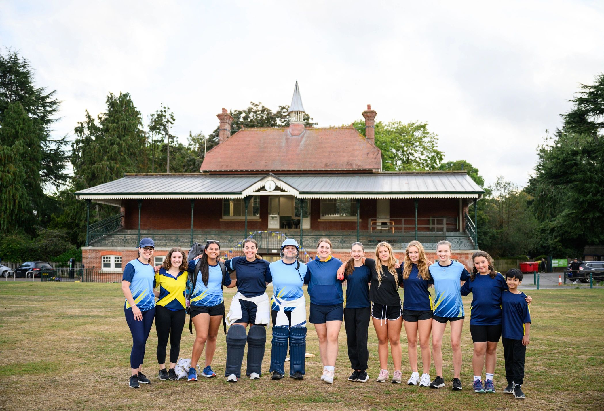 Youth team standing together on a field during a group activity