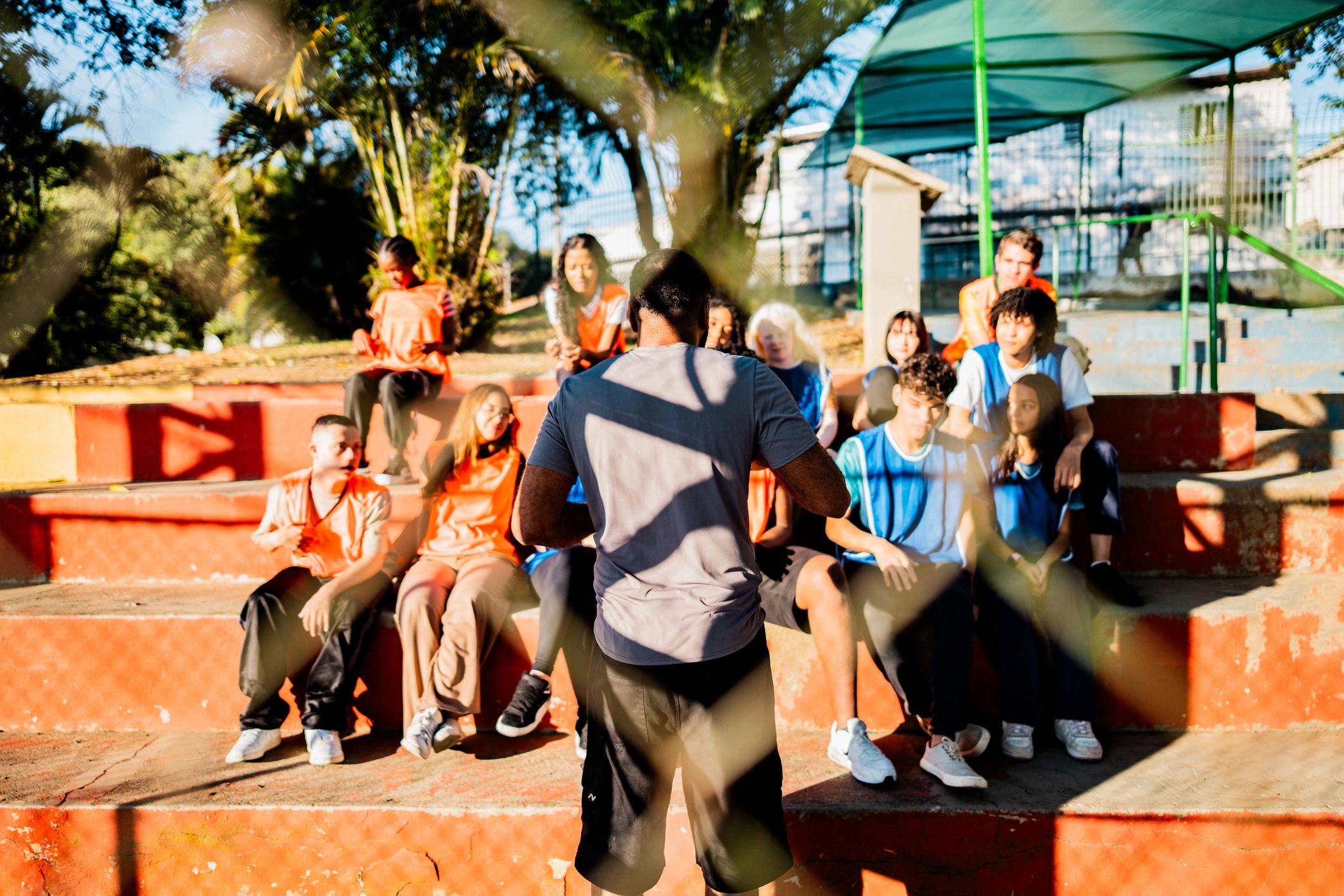 Youth gathered for outdoor instruction on bleachers